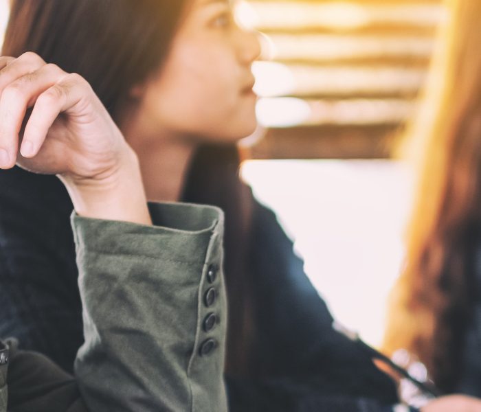 Businesspeople looking and discussing ideas over a board in office